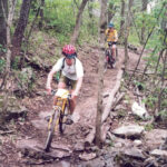 Trails wind through woods, over rock outcroppings, and along the river